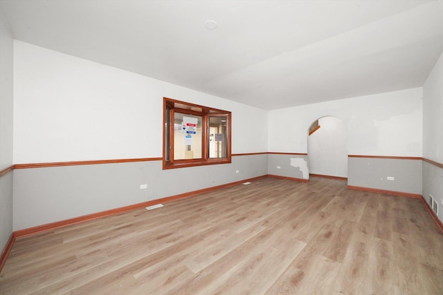 3057 201st Pl, Lynwood, IL 60411 - unfurnished room featuring wood finished floors and arched walkways