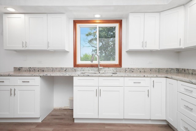 3057 201st Pl, Lynwood, IL 60411 - kitchen with white cabinetry, light wood finished floors, light stone counters, and recessed lighting