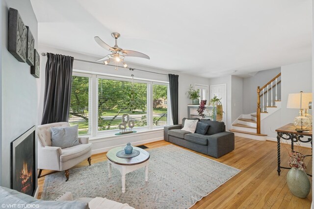 731 N Patton Ave, Arlington Heights, IL 60004 - living room featuring wood finished floors, stairs, and ceiling fan