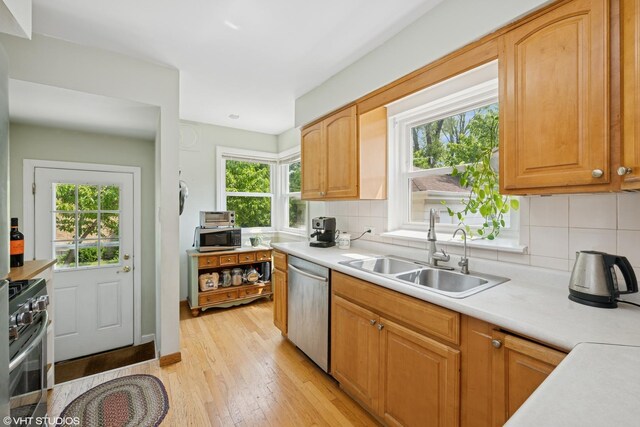 731 N Patton Ave, Arlington Heights, IL 60004 - kitchen with appliances with stainless steel finishes, plenty of natural light, light wood-style flooring, and tasteful backsplash
