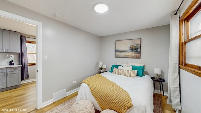 2701 S Hillock Ave, Chicago, IL 60608 - bedroom featuring light wood finished floors and baseboards