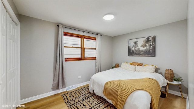 2701 S Hillock Ave, Chicago, IL 60608 - bedroom featuring wood finished floors and a closet