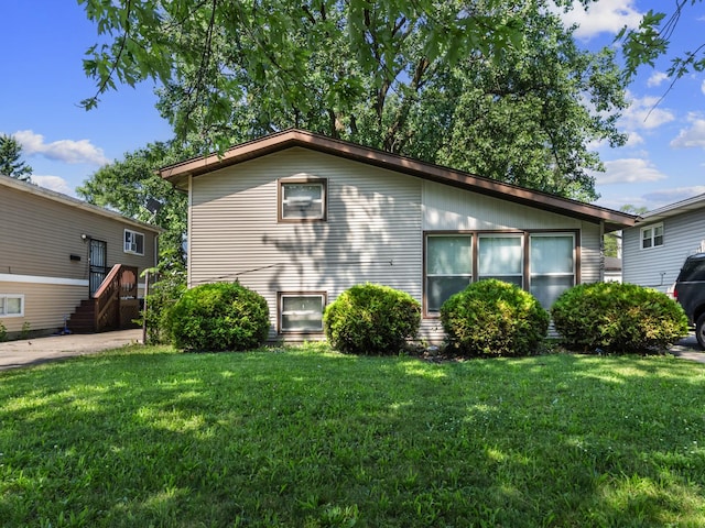 16322 Justine St, Markham, IL 60428 - view of side of home with a lawn