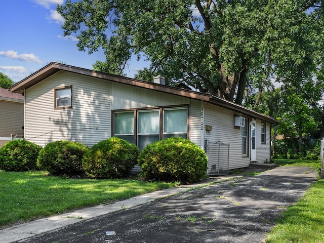 16322 Justine St, Markham, IL 60428 - view of side of property featuring a lawn and a chimney