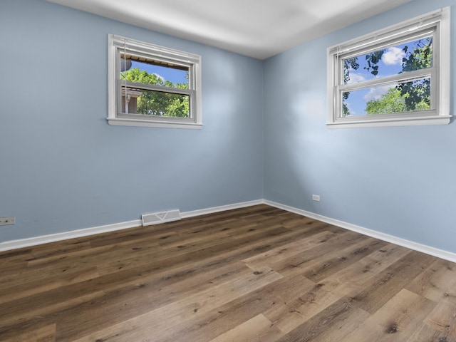 16322 Justine St, Markham, IL 60428 - empty room with plenty of natural light and wood finished floors