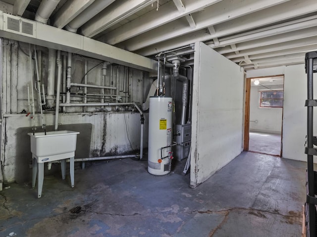 16322 Justine St, Markham, IL 60428 - unfinished below grade area featuring gas water heater and a sink