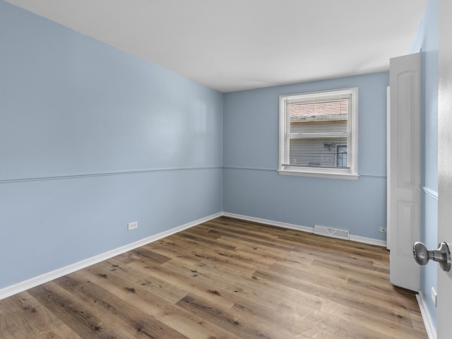 16322 Justine St, Markham, IL 60428 - spare room with wood finished floors and baseboards