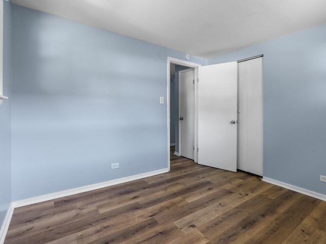 16322 Justine St, Markham, IL 60428 - unfurnished bedroom with wood finished floors and a closet