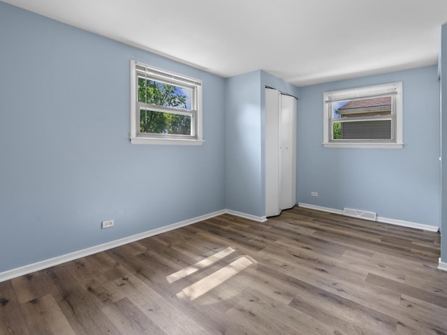 16322 Justine St, Markham, IL 60428 - unfurnished bedroom with wood finished floors and a closet