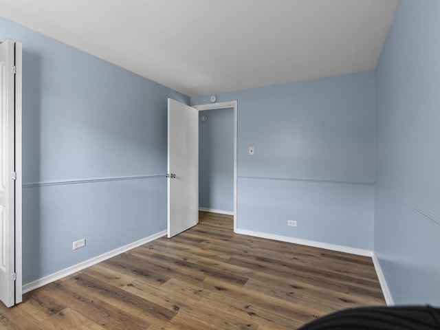 16322 Justine St, Markham, IL 60428 - unfurnished bedroom with baseboards and wood finished floors
