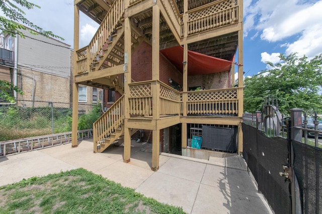 2901 W Washington Blvd Unit 2, Chicago, IL 60612 - rear view of property with stairway, brick siding, and a patio area