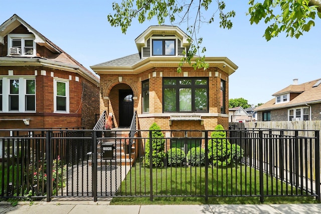 2040 N Laporte Ave, Chicago, IL 60639 - view of front of house with brick siding, a fenced front yard, and covered porch