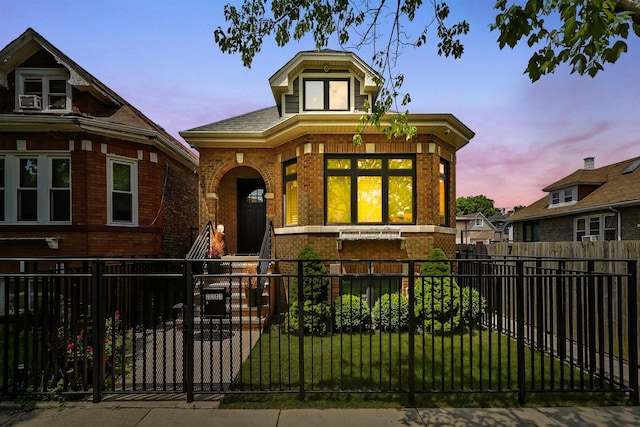 2040 N Laporte Ave, Chicago, IL 60639 - view of front of house with brick siding, covered porch, and a fenced front yard