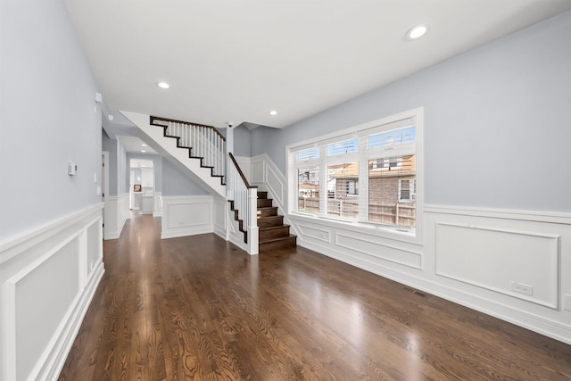 2040 N Laporte Ave, Chicago, IL 60639 - foyer entrance featuring stairs, a wainscoted wall, a decorative wall, recessed lighting, and dark wood-style floors