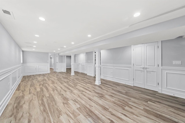 2040 N Laporte Ave, Chicago, IL 60639 - finished basement with a decorative wall, light wood finished floors, a wainscoted wall, and recessed lighting
