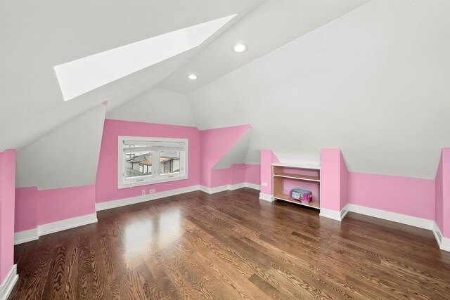 2040 N Laporte Ave, Chicago, IL 60639 - additional living space with a skylight, lofted ceiling, wood finished floors, and recessed lighting