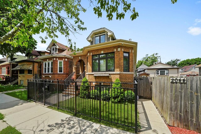 2040 N Laporte Ave, Chicago, IL 60639 - view of front of house featuring brick siding, a fenced front yard, and a gate
