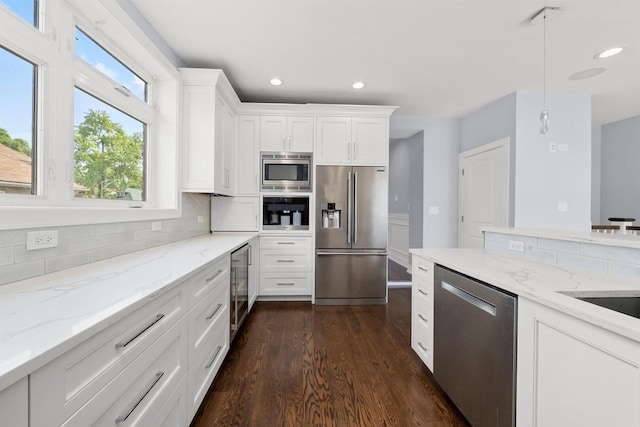 2040 N Laporte Ave, Chicago, IL 60639 - kitchen with appliances with stainless steel finishes, beverage cooler, backsplash, white cabinets, and dark wood finished floors