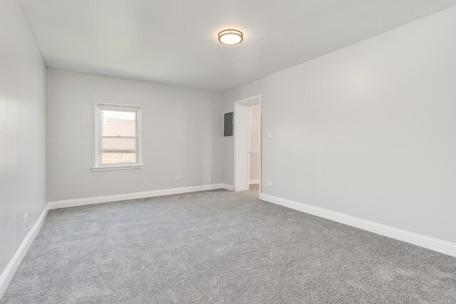 6132 S Justine St, Chicago, IL 60636 - empty room with carpet floors and electric panel
