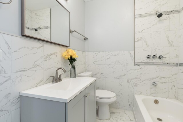 6132 S Justine St, Chicago, IL 60636 - bathroom with tile walls, marble finish flooring, vanity, and shower / bath combination