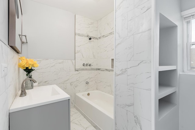 6132 S Justine St, Chicago, IL 60636 - bathroom featuring shower / washtub combination, marble look tiles, and vanity