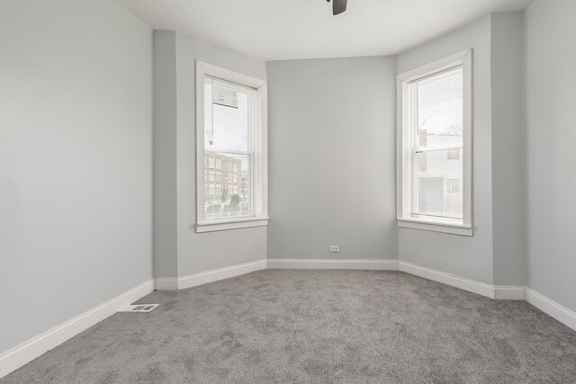 6132 S Justine St, Chicago, IL 60636 - carpeted spare room featuring a ceiling fan and baseboards