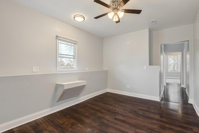 6132 S Justine St, Chicago, IL 60636 - spare room featuring dark wood finished floors and a ceiling fan