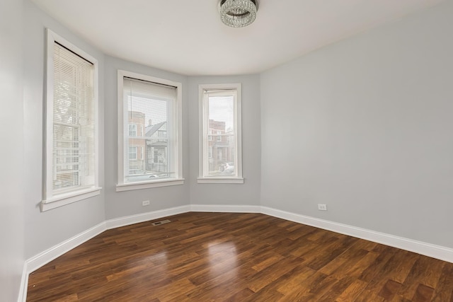 6132 S Justine St, Chicago, IL 60636 - empty room featuring dark wood-type flooring