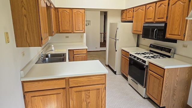 906 E Steger Rd Unit 5, Crete, IL 60417 - kitchen with white appliances, brown cabinets, and light countertops