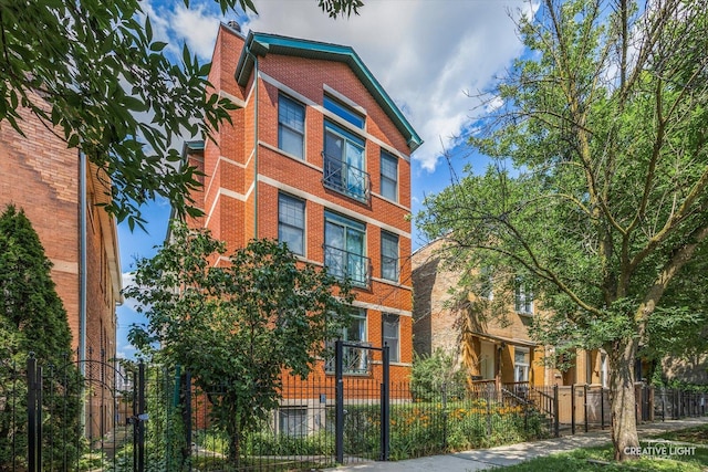 3312 W Beach Ave Unit 1, Chicago, IL 60651 - view of building exterior with a fenced front yard