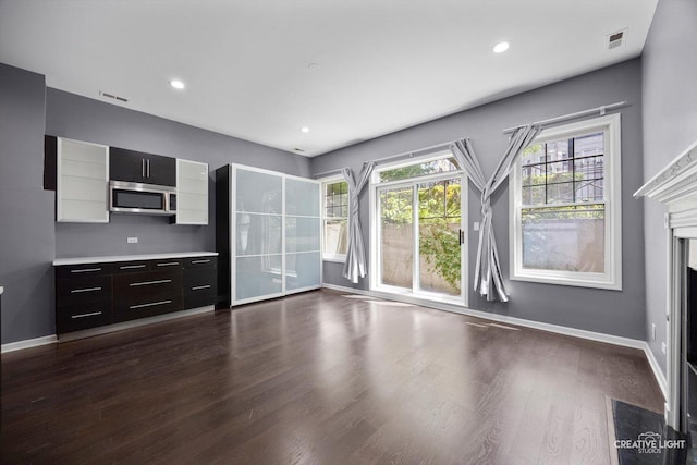 3312 W Beach Ave Unit 1, Chicago, IL 60651 - unfurnished living room with dark wood-style floors, a high end fireplace, and recessed lighting