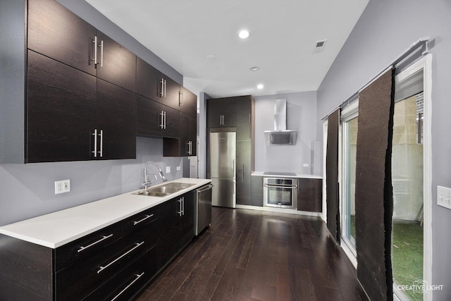 3312 W Beach Ave Unit 1, Chicago, IL 60651 - kitchen with stainless steel appliances, dark wood finished floors, wall chimney exhaust hood, light countertops, and recessed lighting