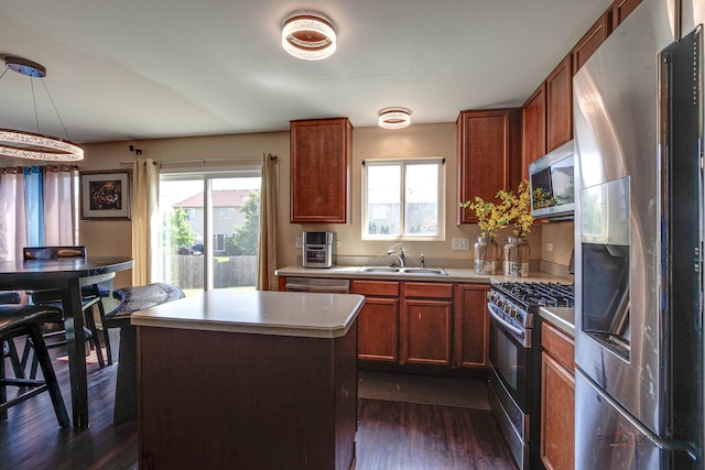 39837 N Torry Ln, Beach Park, IL 60083 - kitchen featuring stainless steel appliances, plenty of natural light, dark wood-style flooring, and light countertops