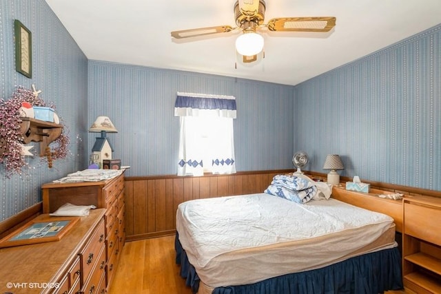 305 Milburn Ave, Crete, IL 60417 - bedroom with light wood finished floors, wallpapered walls, and ceiling fan
