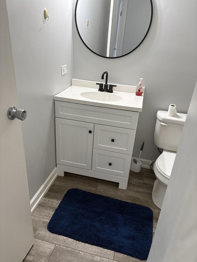 14949 Lakeview Dr Unit 204, Orland Park, IL 60462 - half bathroom with vanity and wood finished floors
