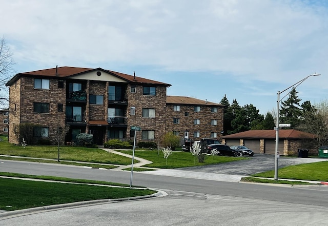 14949 Lakeview Dr Unit 204, Orland Park, IL 60462 - view of building exterior with a detached garage
