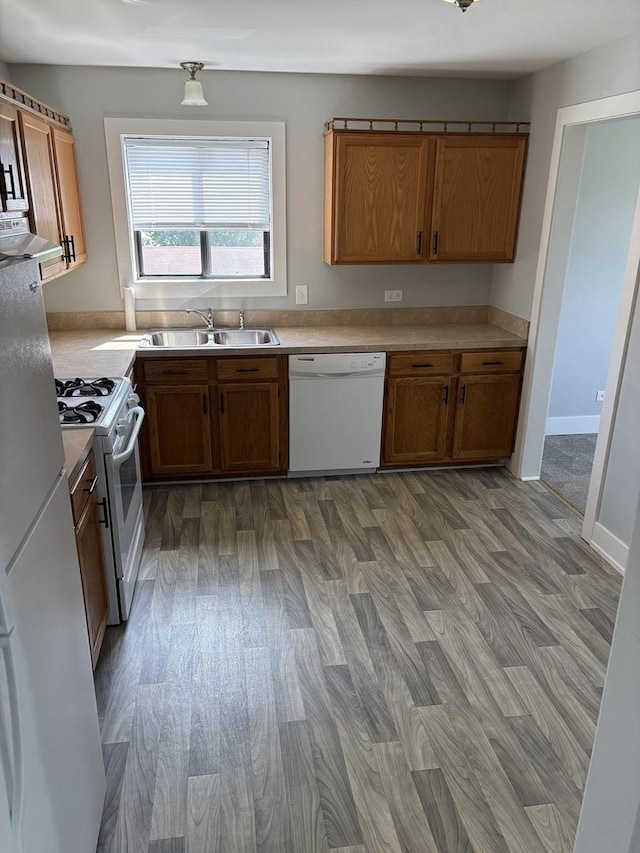 14949 Lakeview Dr Unit 204, Orland Park, IL 60462 - kitchen with white appliances, brown cabinets, and light countertops