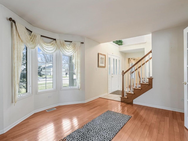 18036 Crystal Ln, Lansing, IL 60438 - foyer with hardwood / wood-style floors, plenty of natural light, and stairs