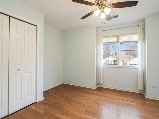 18036 Crystal Ln, Lansing, IL 60438 - unfurnished bedroom with wood-type flooring, a closet, and ceiling fan