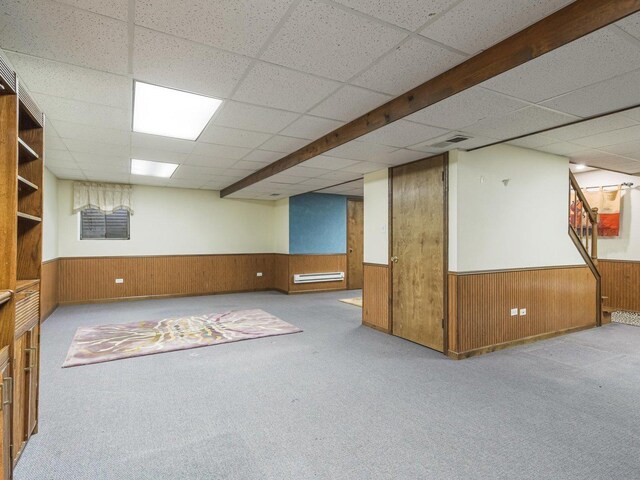 18036 Crystal Ln, Lansing, IL 60438 - finished basement featuring a wainscoted wall, a drop ceiling, carpet floors, wood walls, and baseboard heating