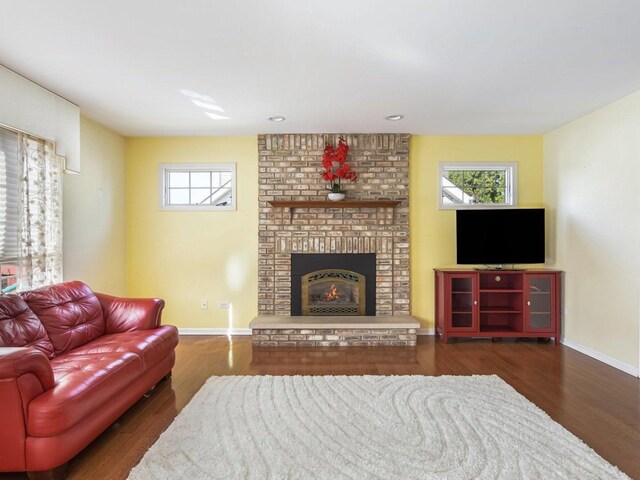 18036 Crystal Ln, Lansing, IL 60438 - living area featuring wood finished floors, a fireplace, and recessed lighting