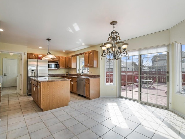 18036 Crystal Ln, Lansing, IL 60438 - kitchen with stainless steel appliances, a kitchen island, dark countertops, light tile patterned floors, and brown cabinetry