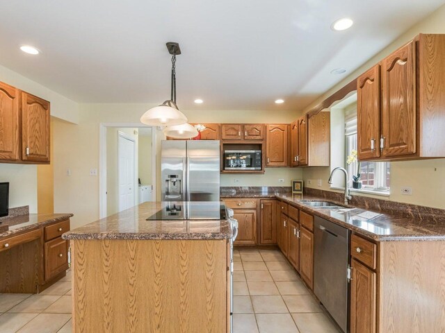 18036 Crystal Ln, Lansing, IL 60438 - kitchen with appliances with stainless steel finishes, light tile patterned floors, dark stone countertops, a center island, and recessed lighting