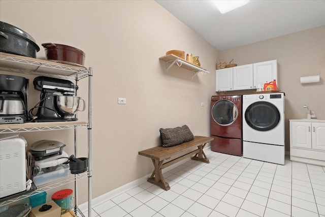 7488 Bittersweet Dr, Gurnee, IL 60031 - laundry room with washer and dryer, cabinet space, and light tile patterned flooring