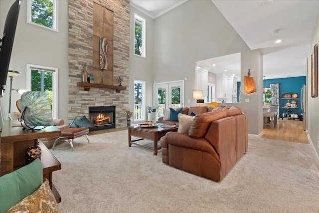 7488 Bittersweet Dr, Gurnee, IL 60031 - living area with carpet, a high ceiling, a stone fireplace, and recessed lighting