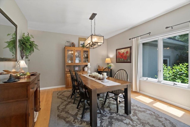 7488 Bittersweet Dr, Gurnee, IL 60031 - dining area featuring light wood-style floors and a chandelier