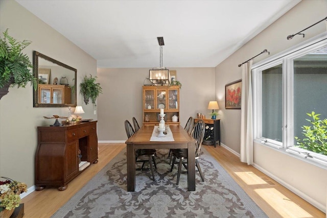 7488 Bittersweet Dr, Gurnee, IL 60031 - dining space with light wood-style floors and a chandelier