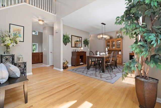 7488 Bittersweet Dr, Gurnee, IL 60031 - dining area with light wood finished floors and a chandelier
