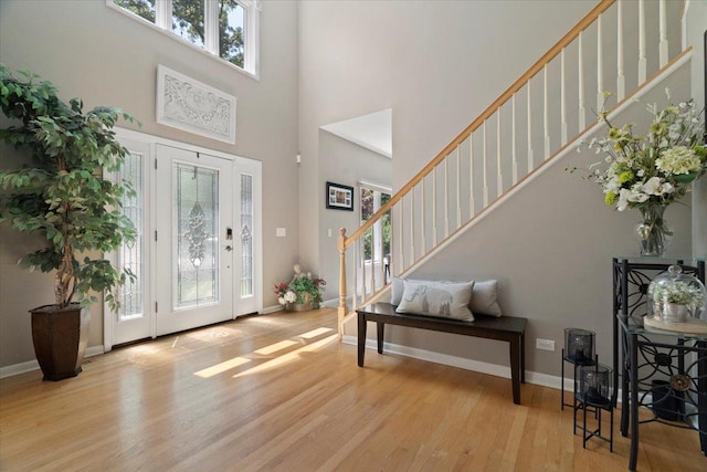 7488 Bittersweet Dr, Gurnee, IL 60031 - entrance foyer featuring a towering ceiling, healthy amount of natural light, wood finished floors, and stairway