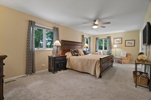 7488 Bittersweet Dr, Gurnee, IL 60031 - bedroom featuring multiple windows, light colored carpet, and ceiling fan